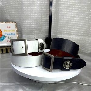 (H)Two Pebble Beach boys' leather belts with black and white metal silve buckles